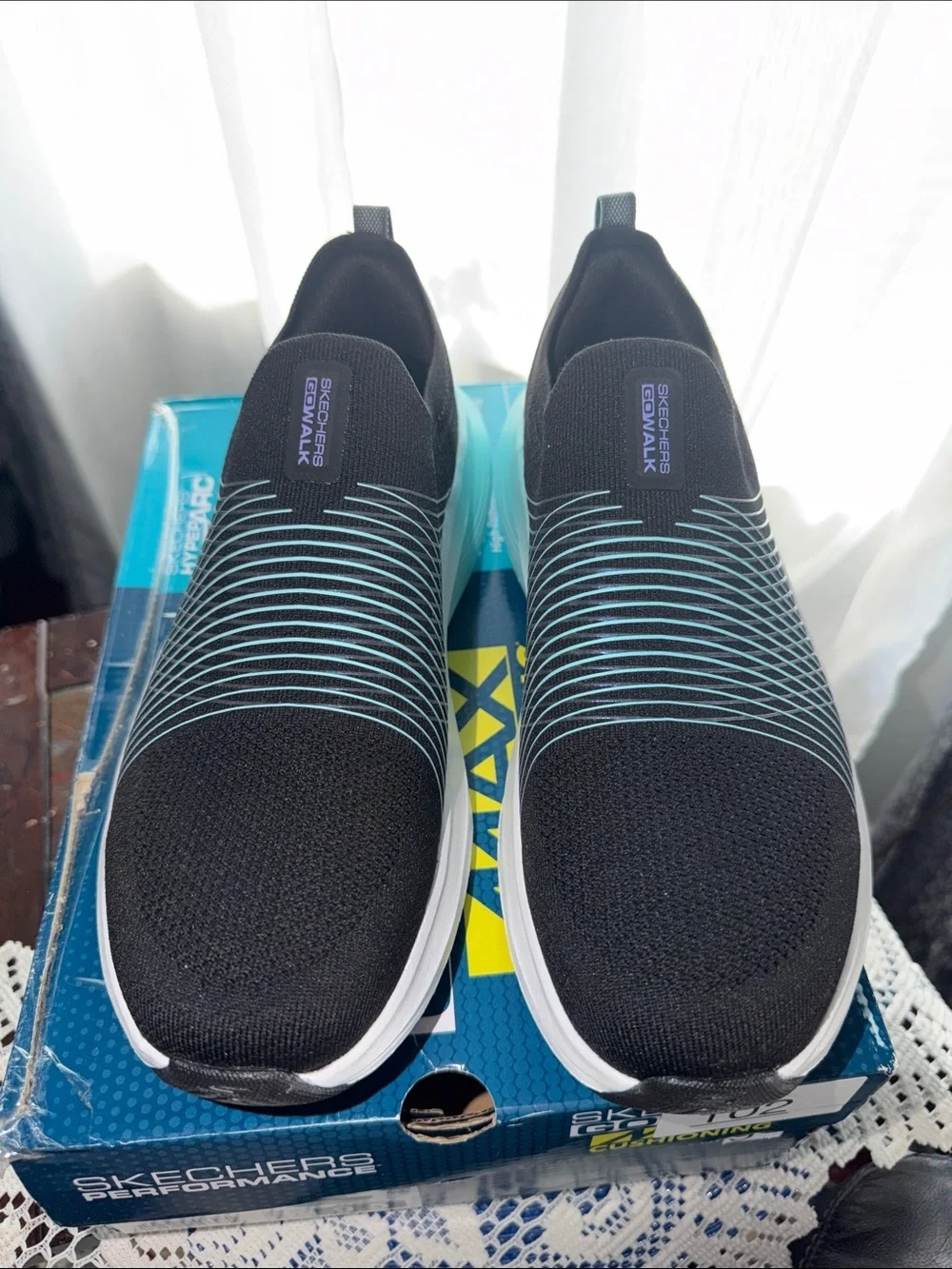 Skechers Women’s  Black with Teal Stripe Slip-On Sneakers